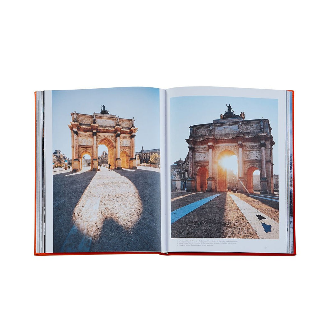 Open book showing two images of a historical arch with different lighting conditions.