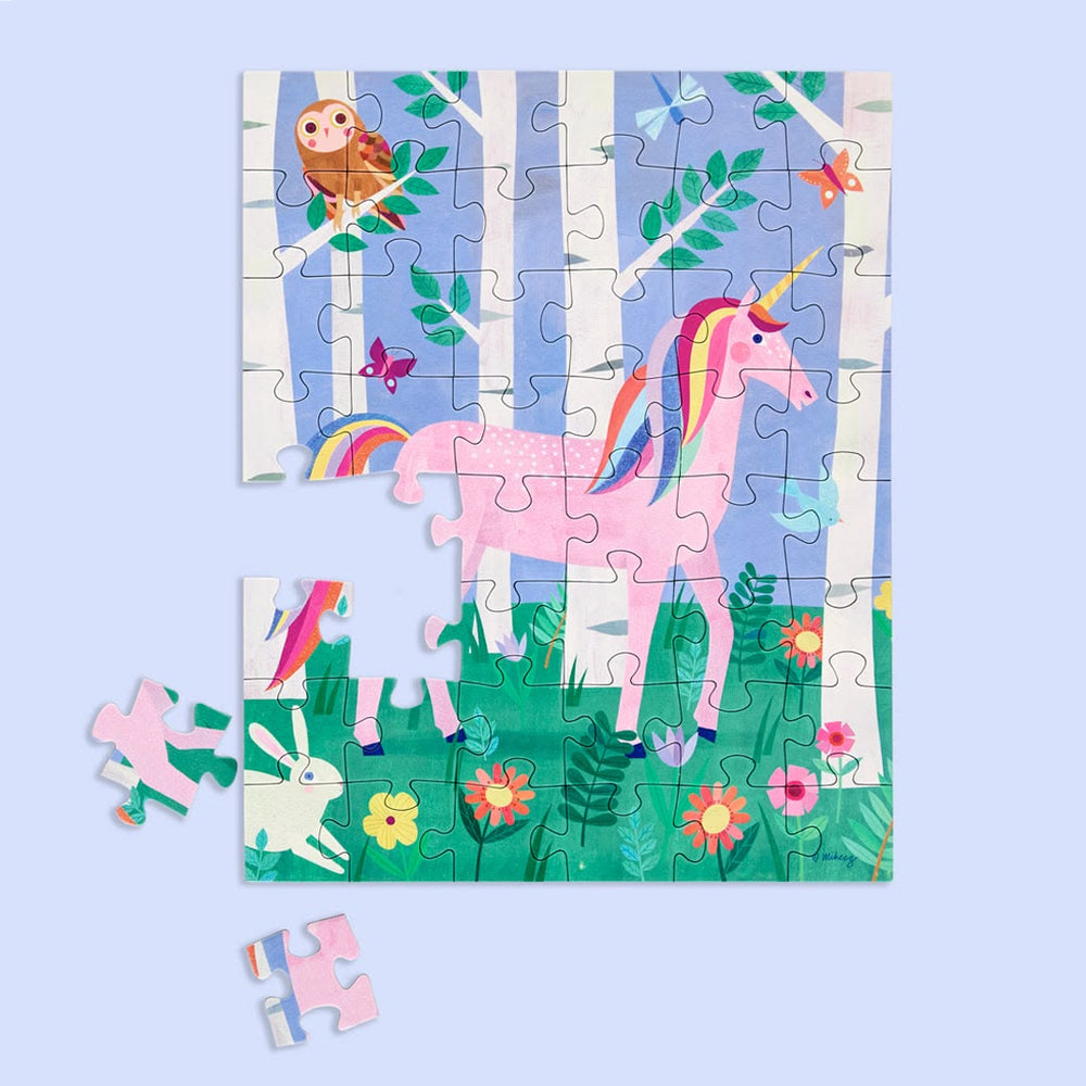 Children's puzzle with a unicorn in a forest design on a light blue background