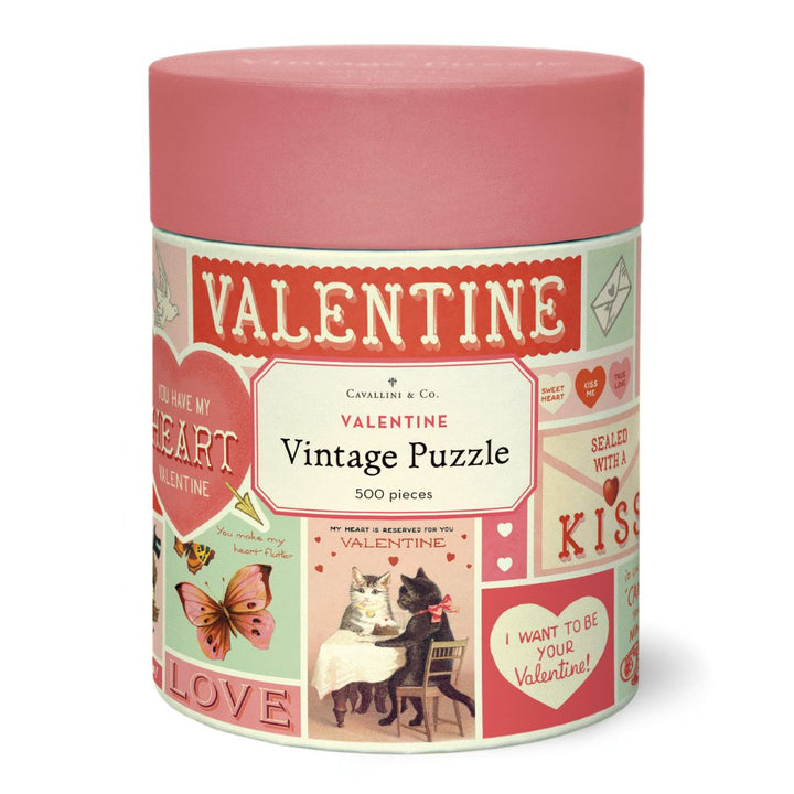 Valentine-themed puzzle packaging with a pink lid and colorful label on a white background