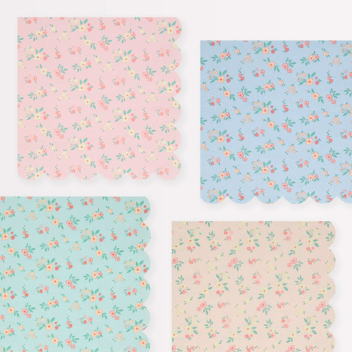 Four floral patterned paper sheets in pink, blue, and beige.