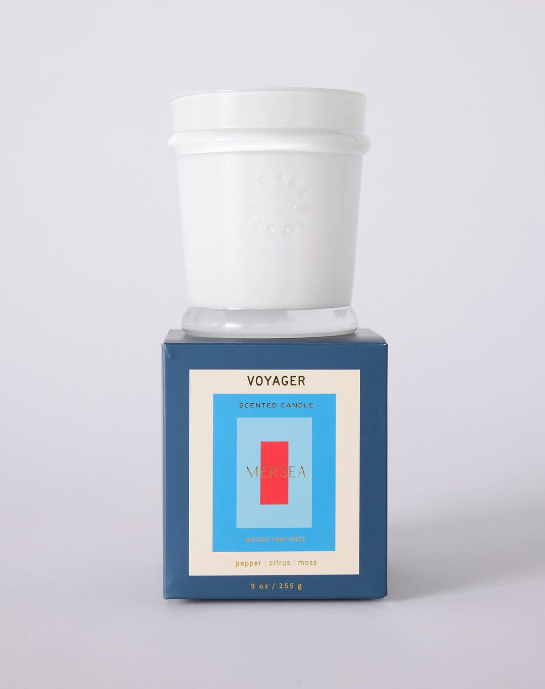 Voyager scented candle in a blue box on a white background
