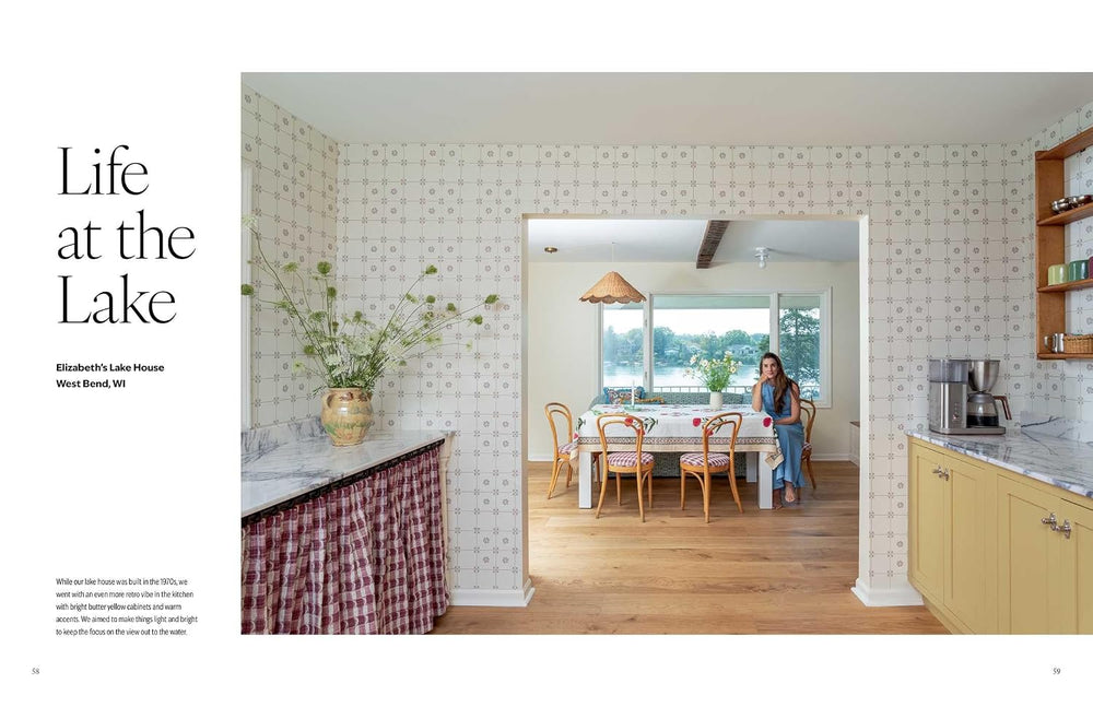 A magazine-style interior photo page with the headline 'Life at the Lake' and a photo of a woman standing in a bright kitchen and dining area. The page includes architectural text on the left and a large interior scene on the right showing patterned wallpaper, wood floors, counters, and a table with chairs.