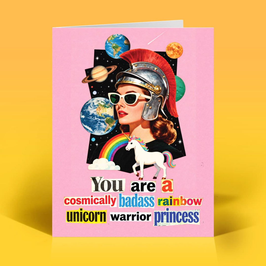 Card with a design of a woman in a helmet, unicorn, and planets on a pink background with text.
