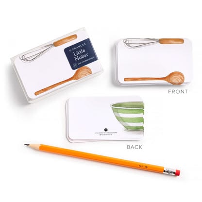 Notebook with wooden spoon design, pencil, and small bowl illustration on a white background