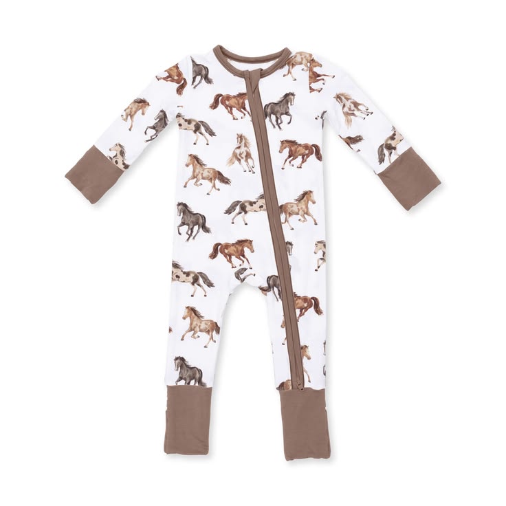 A baby long-sleeve footed sleeper with a white background covered in a brown and tan horse print, featuring solid brown cuffs and foot cuffs, and a brown front zipper.