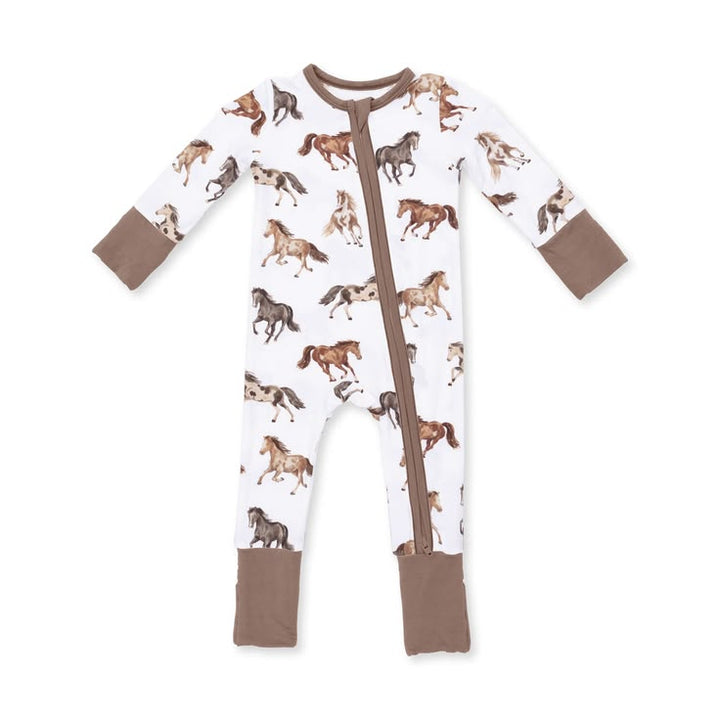 A baby long-sleeve footed sleeper with a white background covered in a brown and tan horse print, featuring solid brown cuffs and foot cuffs, and a brown front zipper.