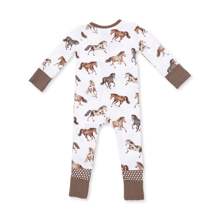 A baby long-sleeve footless one-piece pajama with an all-over horse print on a white background, featuring brown cuffs and leg cuffs with a polka dot pattern.