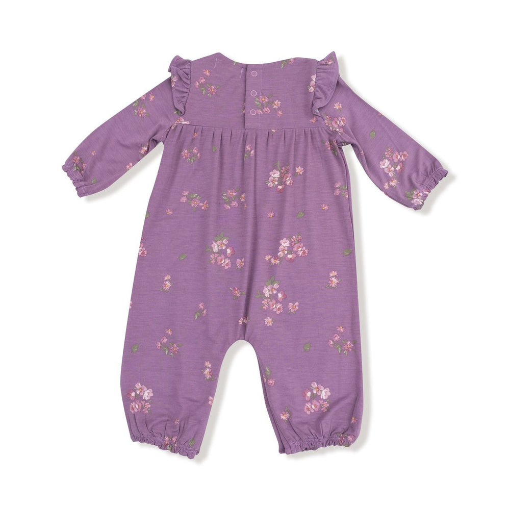 Purple baby romper with floral pattern on a white background