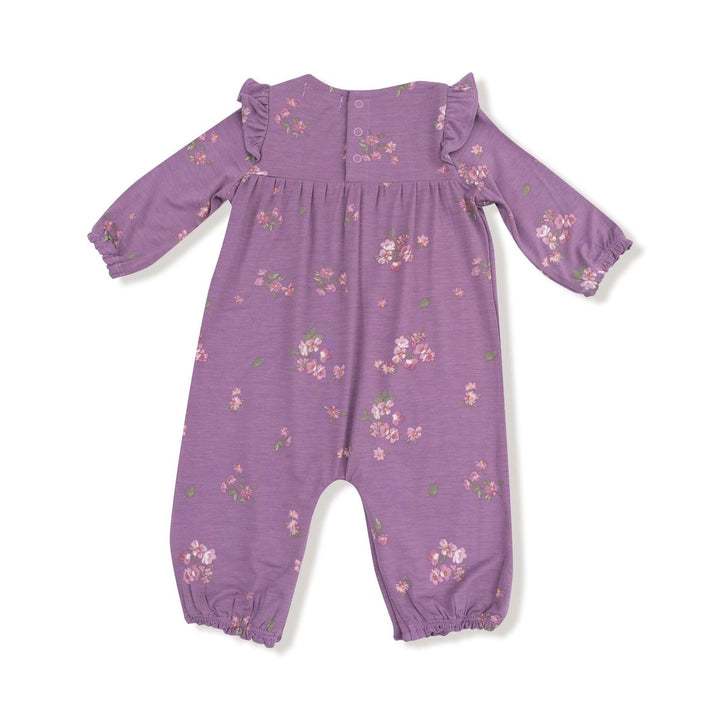 Purple baby romper with floral pattern on a white background