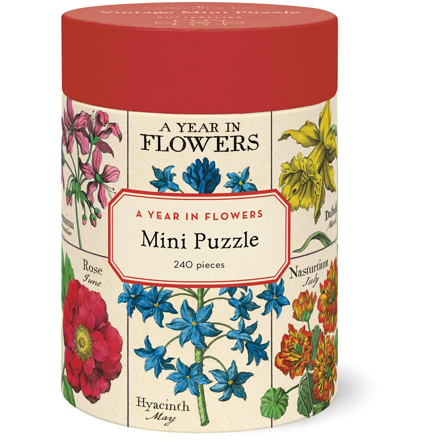 Jigsaw puzzle packaging with floral design and red lid
