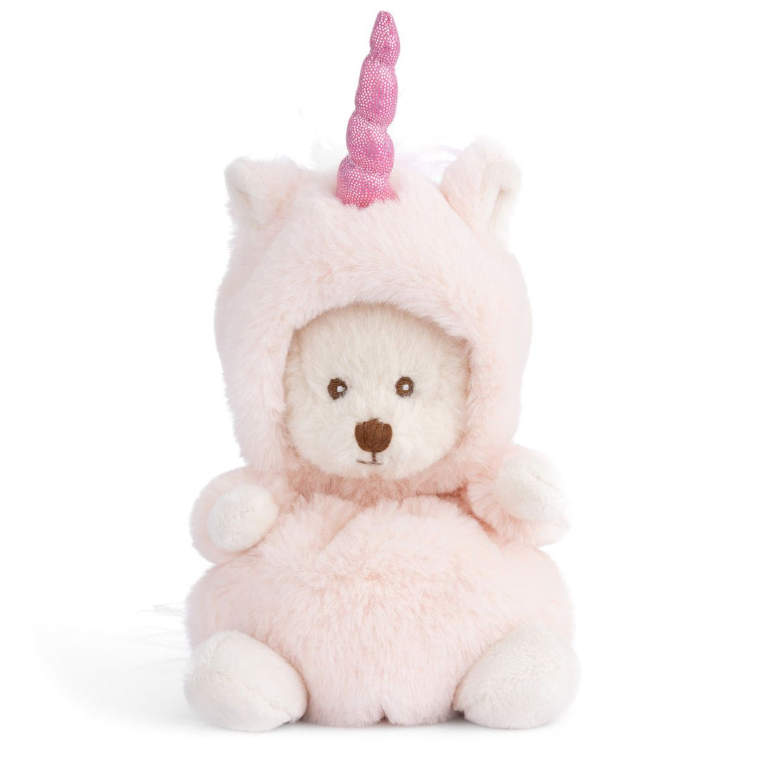 Plush toy bear wearing a unicorn costume with a pink horn on a white background