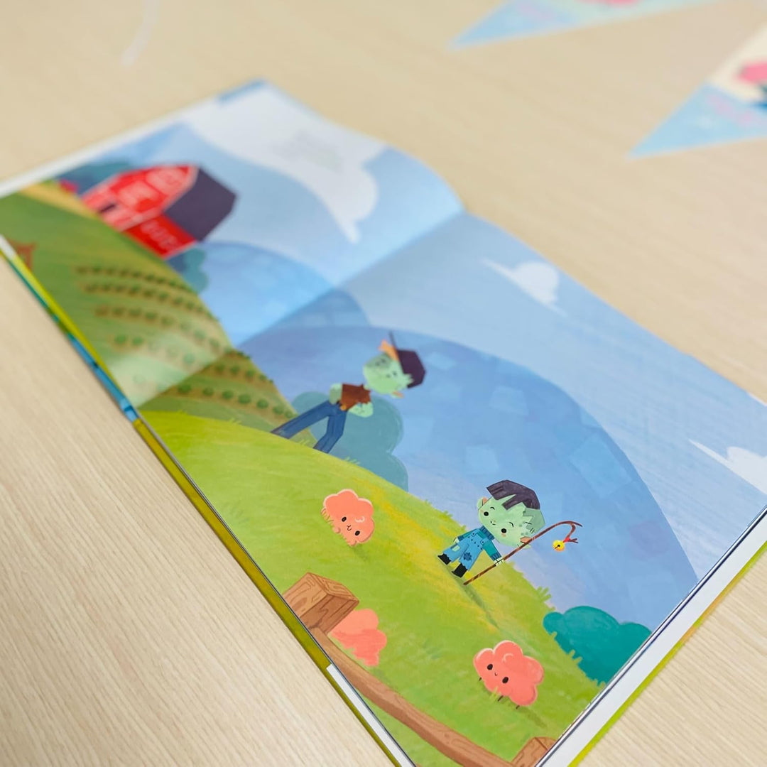 Children's book with colorful illustrations of a boy and girl fishing on a wooden bench.