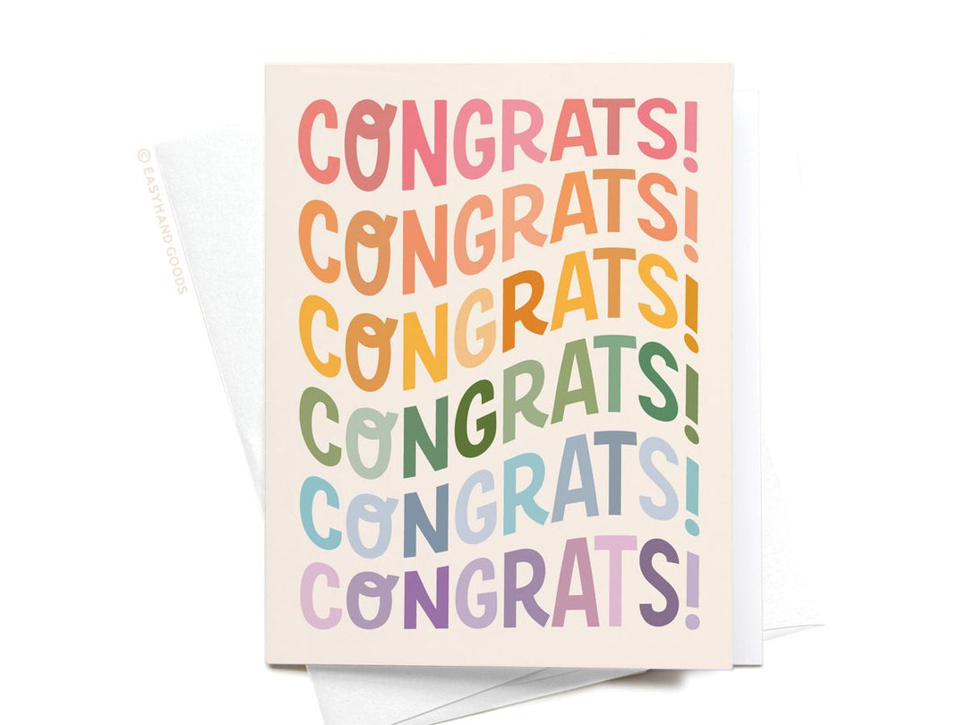Greeting card with 'CONGRATS!' text in rainbow colors on a beige background